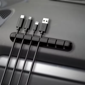 Adhesive cable holder clips for organizing USB, charger, and earphone cables. Easy to use and perfect for workspaces.