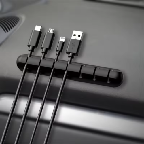 Adhesive cable holder clips for organizing USB, charger, and earphone cables. Easy to use and perfect for workspaces.